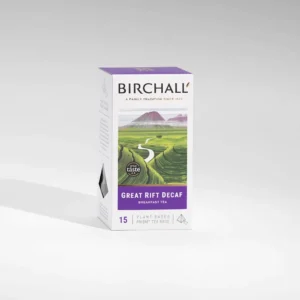 Enjoy a box of Birchall Great Rift Decaf Prism Tea Bags, containing 15 prism tea bags ideal for creating a cozy café atmosphere. The packaging is adorned with an illustration of green hills and mountains, featuring a calming light purple and green color palette that evokes the peaceful scenery viewed by a barista in the morning.