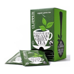 A box of Clipper Organic Pure Green Tea, Tagged & Enveloped with 25 tea bags is displayed beside it, making it an ideal addition to any café's selection. The packaging boasts a green design featuring a teacup and leaves, which makes it popular among baristas. The Fairtrade logo is prominently visible on the packaging.
