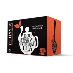 A box of Clipper Everyday One Cup Tea Bags, adorned with a teapot silhouette, ideal for any café ambiance. The package contains 1120 unbleached tea bags and highlights "natural, fair, & delicious" attributes against a black and orange backdrop—a barista's dream.