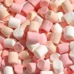 A delightful array of soft Pink & White Mini Mallows fills the frame, evoking the sweet treats you'd find atop a barista-crafted latte in a charming café.