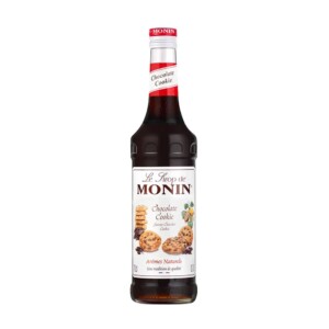 A bottle of Monin Chocolate Cookie syrup with a red cap, perfect for any barista or café, featuring a label adorned with chocolate chip cookie images and text in French. The bottle is filled with rich, dark brown syrup.